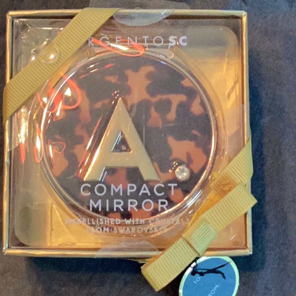 New an never opened compact mirror